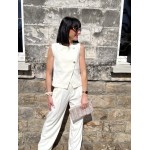 Boléro sans manches avec boutons dorés – Accessoire tailleur chic | Melle Jeanne